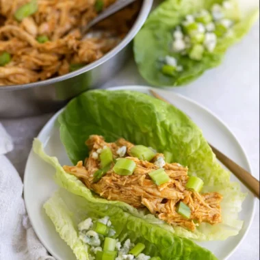 Delicious Buffalo Chicken Lettuce Wraps topped with fresh vegetables