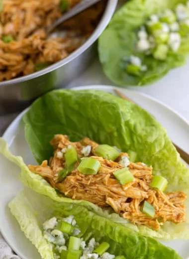 Delicious Buffalo Chicken Lettuce Wraps topped with fresh vegetables