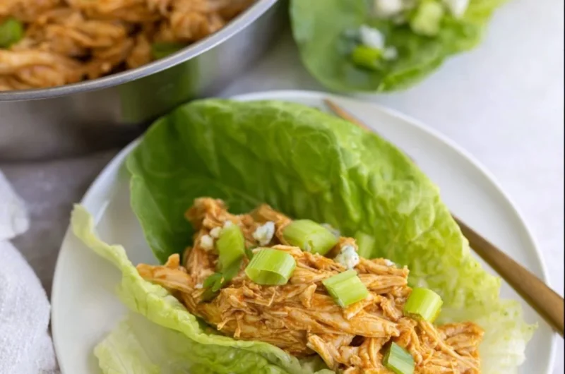 Delicious Buffalo Chicken Lettuce Wraps topped with fresh vegetables