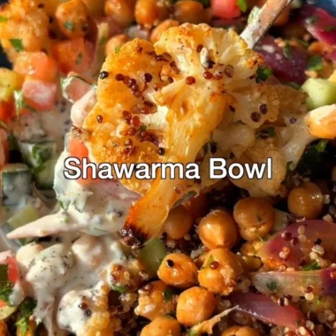 Delicious Cauliflower Shawarma Bowl on a sheet pan with fresh vegetables.