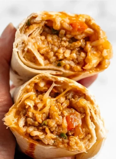 Delicious cheesy chicken burritos wrapped in golden tortillas