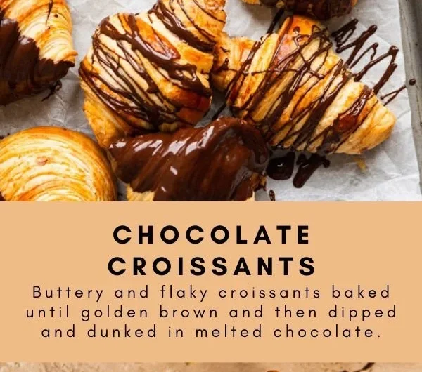 Freshly baked chocolate croissants with flaky pastry and rich chocolate filling