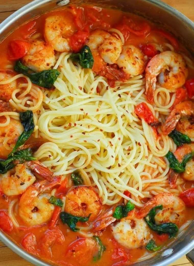 Shrimp pasta dish with garlic basil tomato sauce served in a bowl