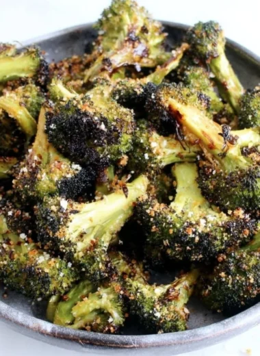 Delicious roasted broccoli with lemon and garlic garnished on a plate