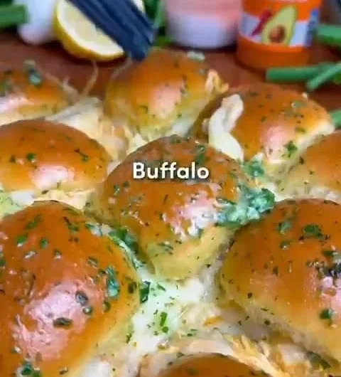 Buffalo Chicken Sliders on a platter with garnishes