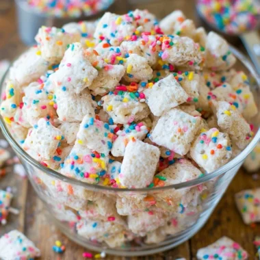 Delicious Cake Batter Puppy Chow dessert in a bowl.