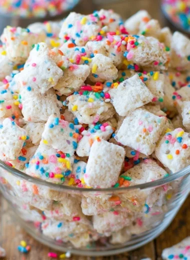 Delicious Cake Batter Puppy Chow dessert in a bowl.