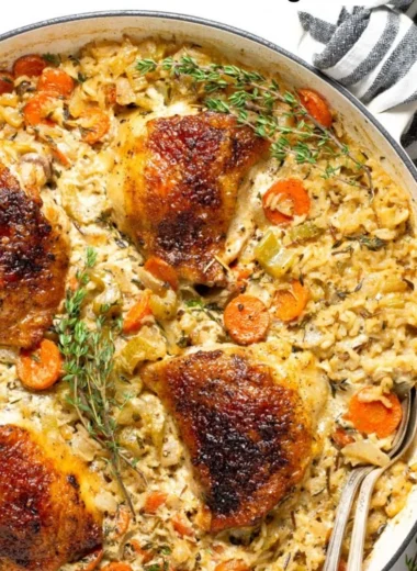 Delicious Chicken Rice Casserole topped with cheese and herbs