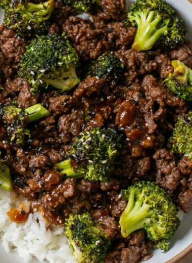 Cozy ground beef and broccoli dish served in a bowl with a side of rice