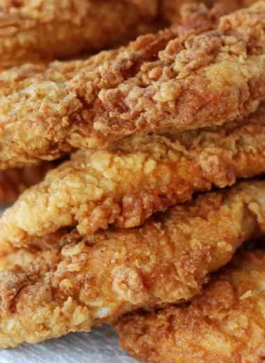 Crispy golden-brown chicken tenders served with dipping sauce