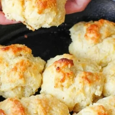 Plate of fluffy, golden easy drop biscuits fresh out of the oven