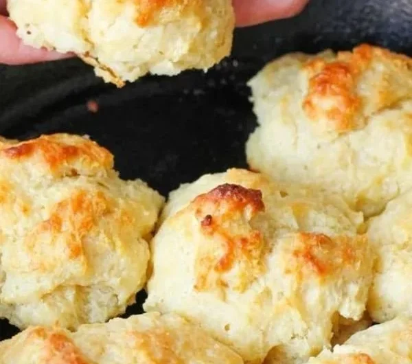 Plate of fluffy, golden easy drop biscuits fresh out of the oven