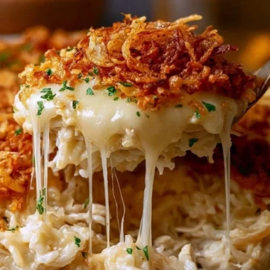 Delicious French onion chicken rice served on a plate with herbs