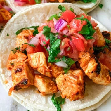 Delicious grilled chicken street tacos garnished with fresh vegetables