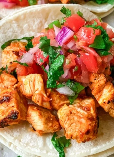 Delicious grilled chicken street tacos garnished with fresh vegetables