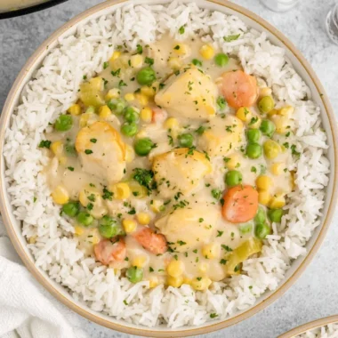High protein crustless chicken pot pie topped with fresh herbs and vegetables