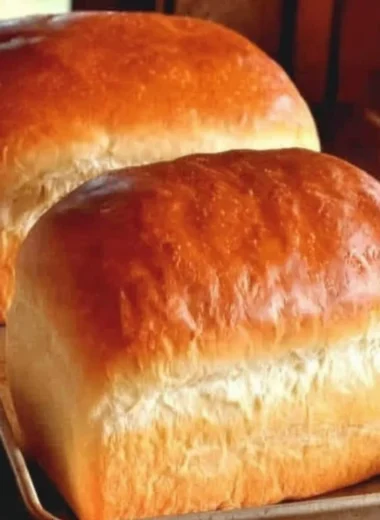 Freshly baked homemade Amish white bread on a wooden table
