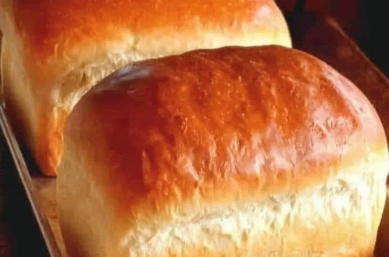 Freshly baked homemade Amish white bread on a wooden table