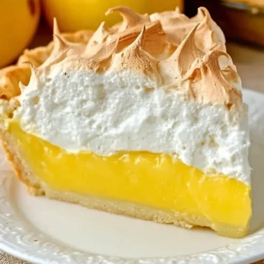 Homemade lemon meringue pie with golden meringue topping and lemon filling