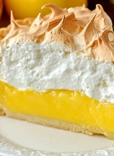 Homemade lemon meringue pie with golden meringue topping and lemon filling