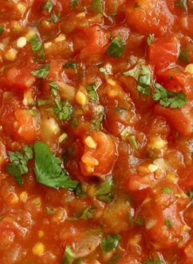 Bowl of homemade smoked salsa with fresh ingredients and tortilla chips