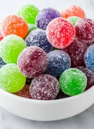 Delicious Kool-Aid Grapes coated in vibrant flavored powder.