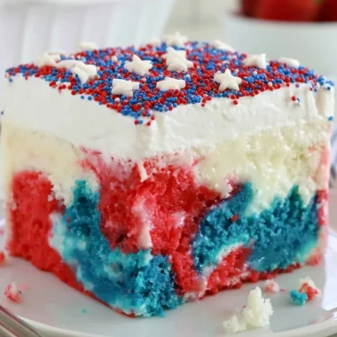 Delicious red, white, and blue Patriotic Poke Cake for 4th of July celebrations.