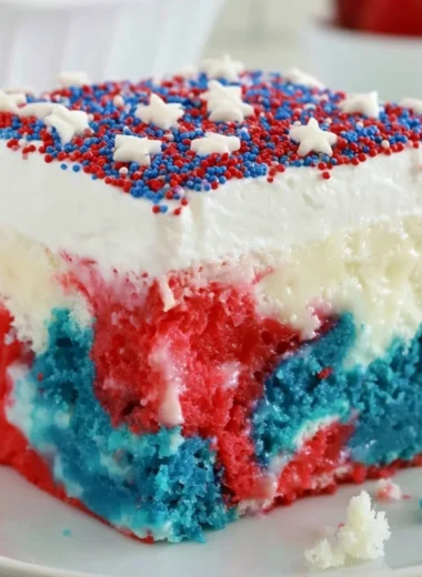Delicious red, white, and blue Patriotic Poke Cake for 4th of July celebrations.