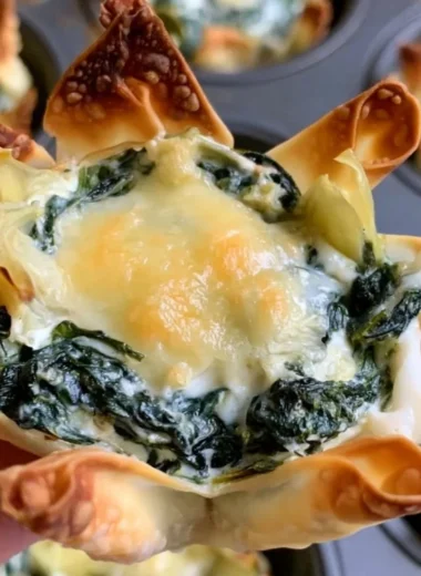Spinach and artichoke wonton cups served on a platter