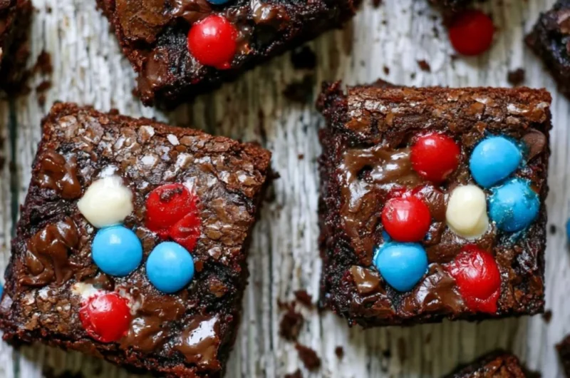 Delicious easy brownies on a plate with chocolate drizzle