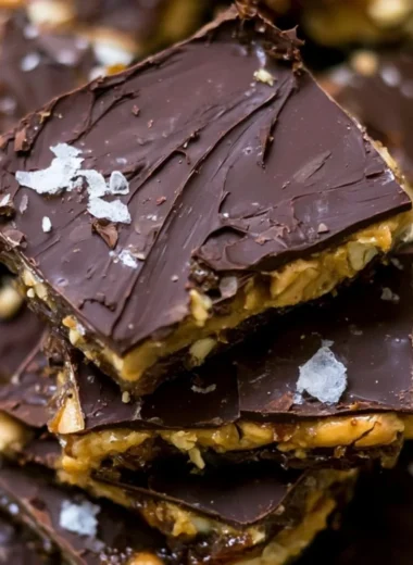 Viral chocolate date bark topped with nuts and drizzled with chocolate.