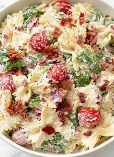 Delicious BLT Pasta Salad with bacon, lettuce, and tomatoes in a bowl.