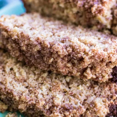 Sliced Coffee Cake Banana Bread on a wooden board with coffee cup