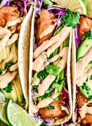 Deliciously prepared cozy Baja fish tacos topped with fresh ingredients.