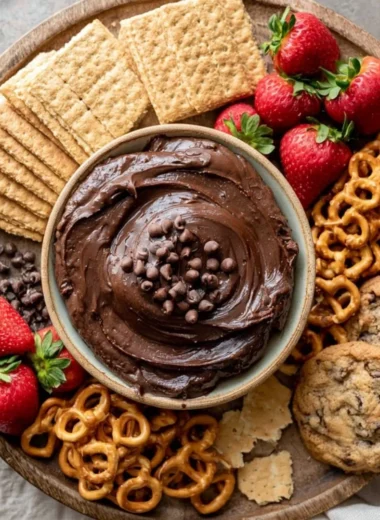 Cozy brownie batter dip served in a bowl with chocolate chips