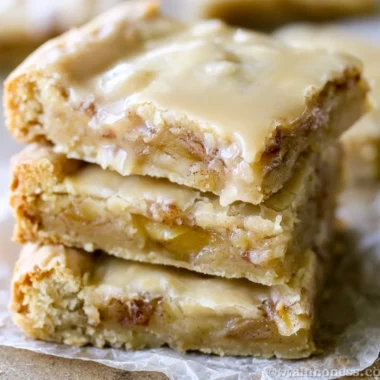 Cozy maple glazed apple blondies freshly baked and drizzled with maple glaze.