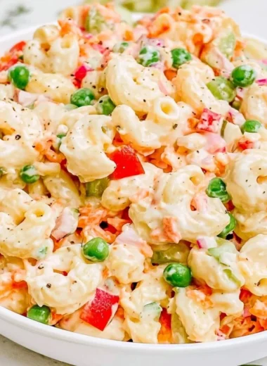 Creamy macaroni salad with vegetables in a bowl