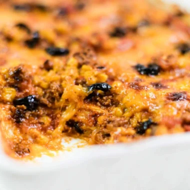 Easy taco bake recipe with layers of cheese, ground meat, and taco seasoning