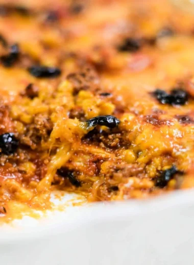 Easy taco bake recipe with layers of cheese, ground meat, and taco seasoning