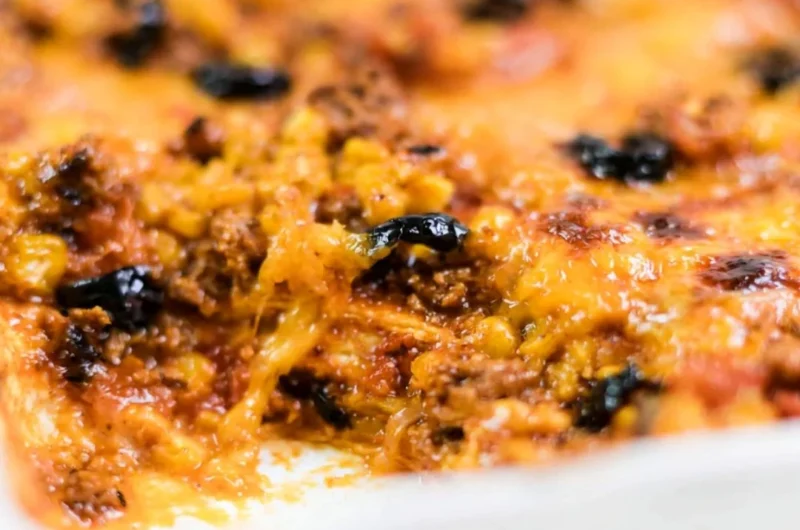 Easy taco bake recipe with layers of cheese, ground meat, and taco seasoning