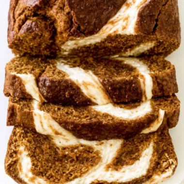 Loaf of delicious Pumpkin Cream Cheese Bread on a wooden table