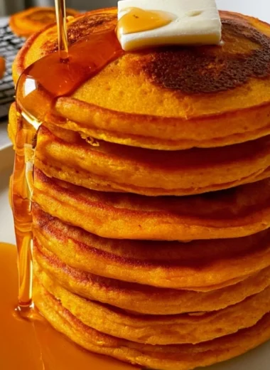 Cozy Pumpkin Cottage Cheese Pancakes served on a plate with maple syrup