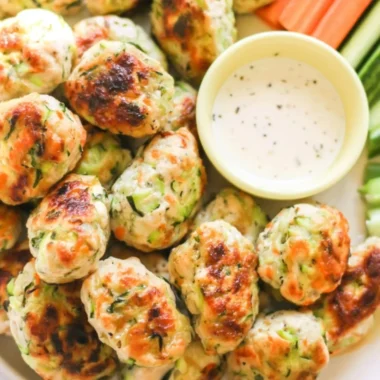 Kid-friendly veggie chicken nuggets on a plate with dipping sauce