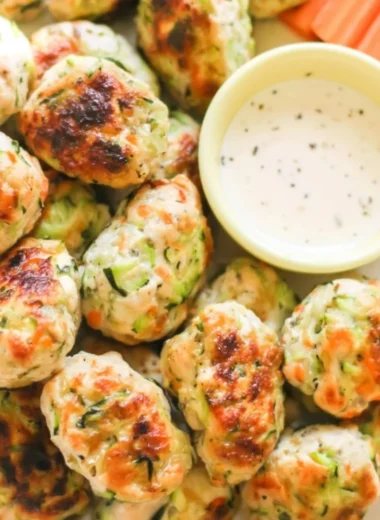 Kid-friendly veggie chicken nuggets on a plate with dipping sauce
